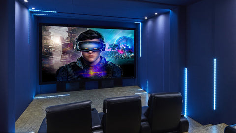 Modern home theater setup with large screen display and VR gaming chair as alternative home theater seating option.